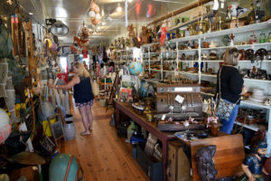 Visitors to Swansboro shop the eclectic offerings at The Poor Man's Hole antique store in the historic Onslow County town.